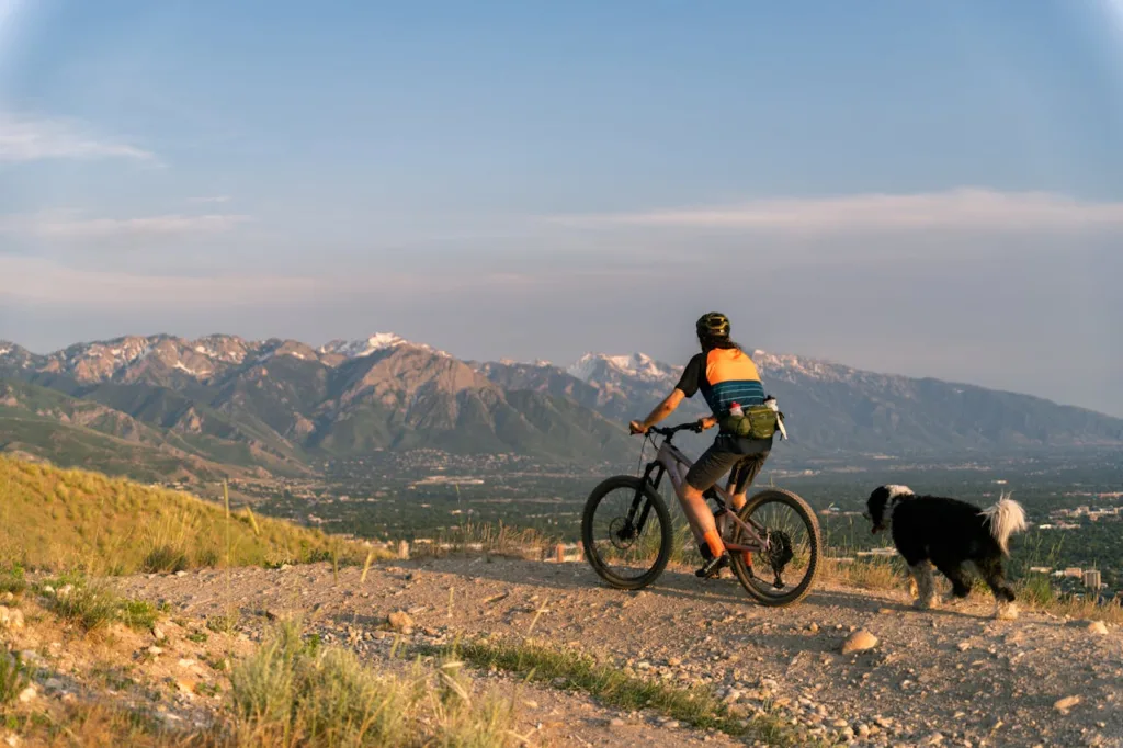 man riding mountain bike on scenic path