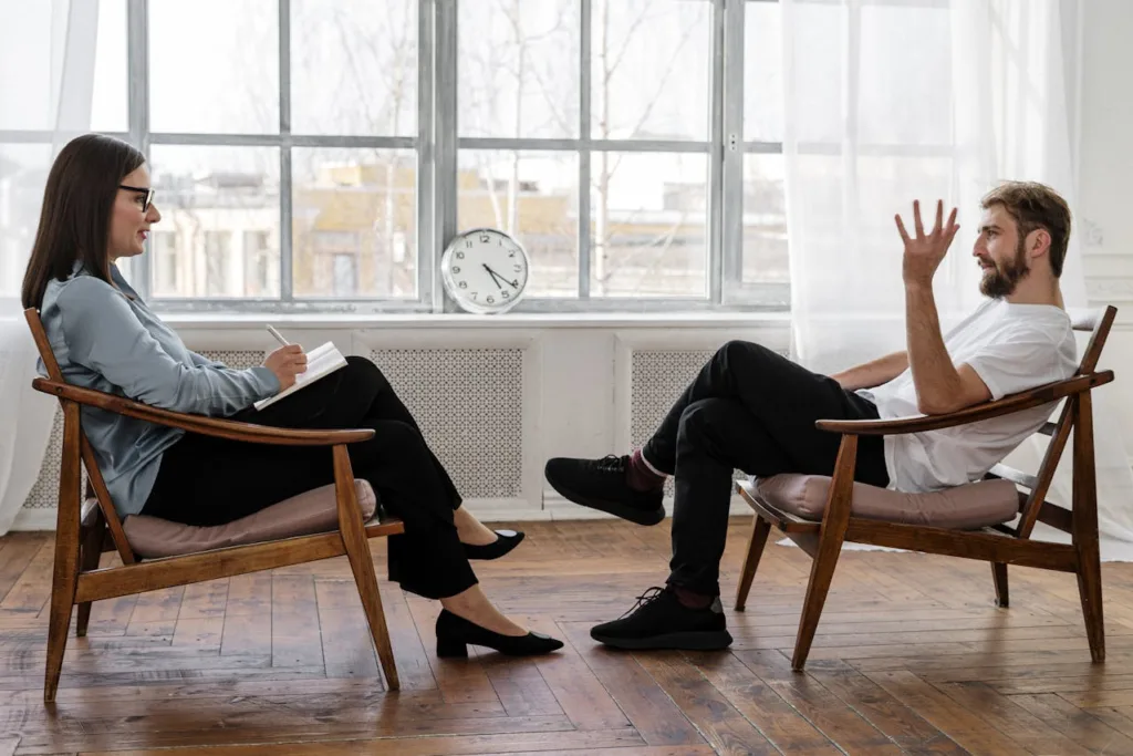 Man speaking with counselor