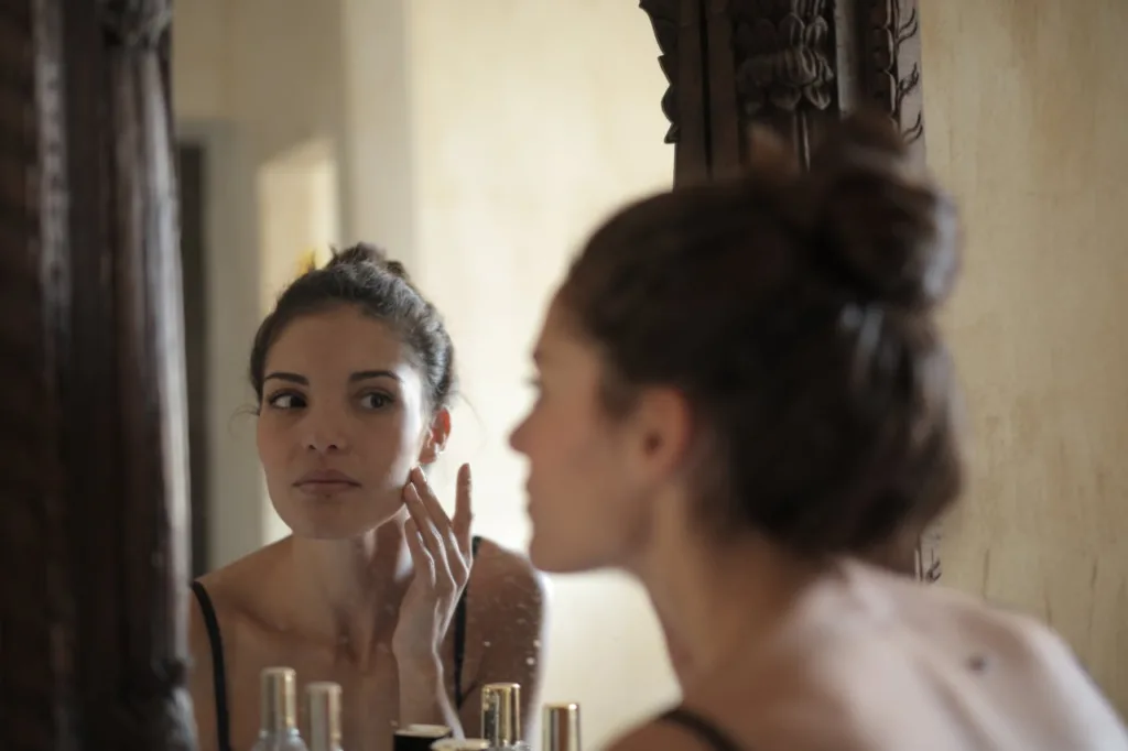 woman applying skincare product
